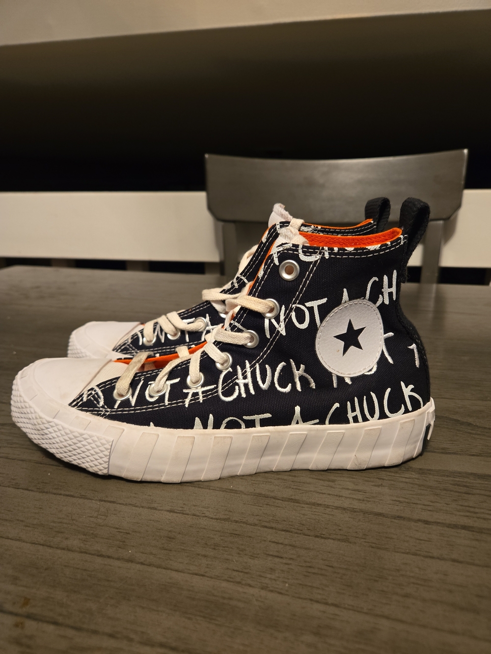 Converse Black & White High-Top Sneakers with Orange Trim